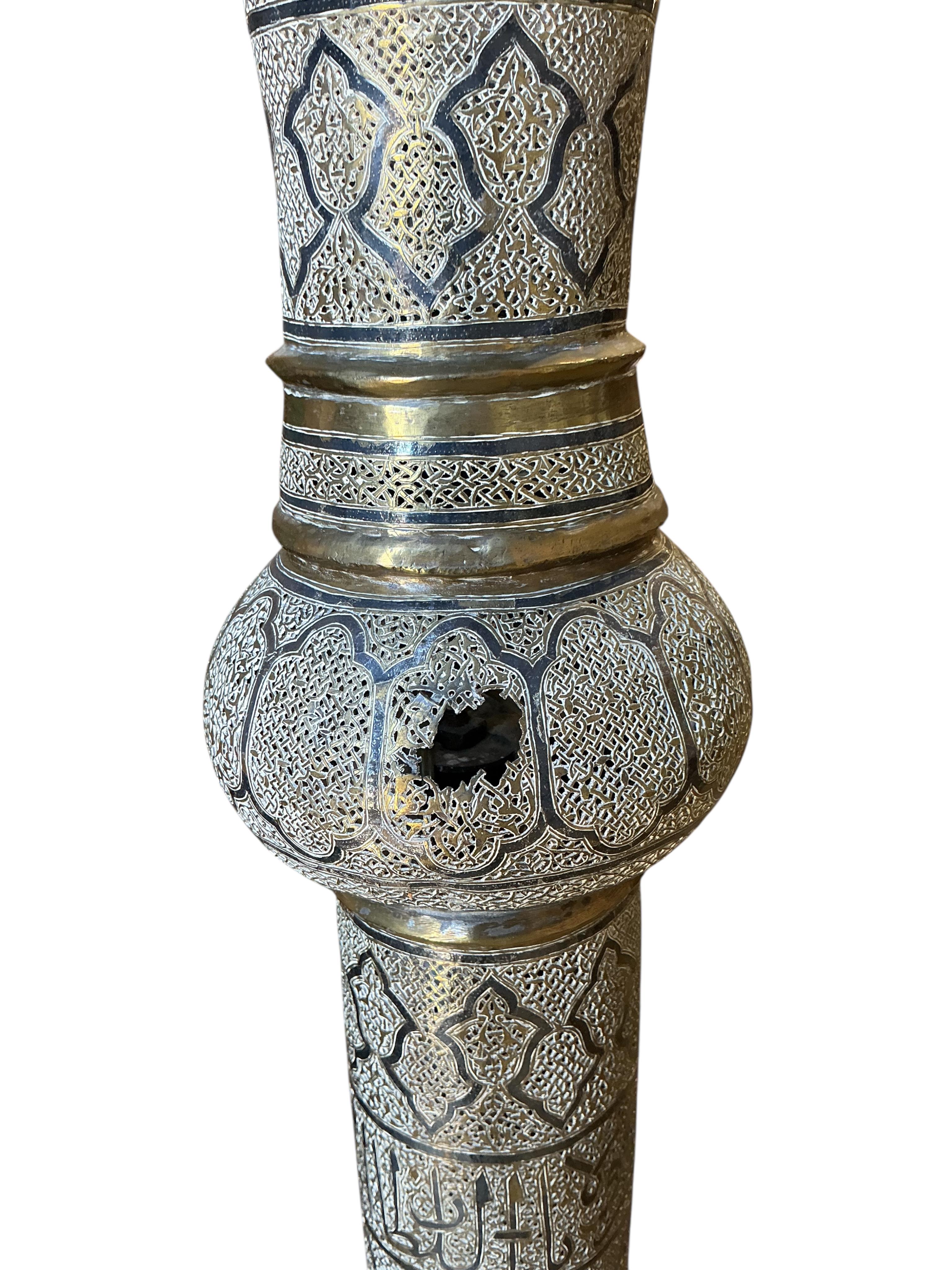A Turkish Isfahan pierced tinned copper standard lamp, height 154cm